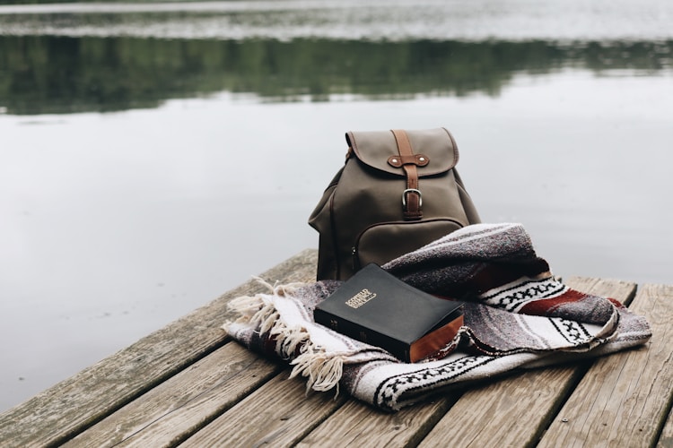 black and white scarf on brown wooden dock